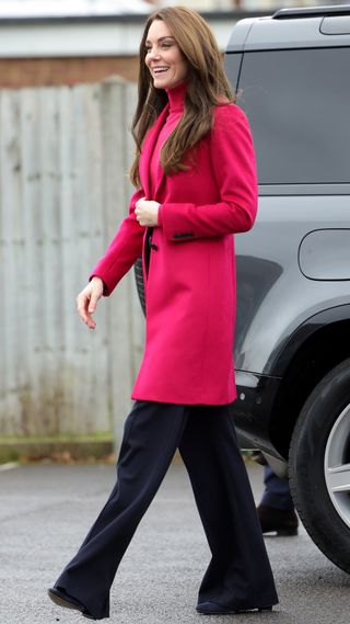 Catherine, Princess of Wales smiles as she arrives for the visit to Windsor Foodshare with Prince William, Prince of Wales on January 26, 2023