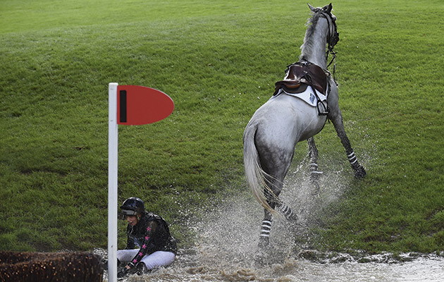 Gina Ruck riding REHY TOO, during the Cross Country falls falling thrills and spills of The Land Rover Burghley Horse Trials near Stamford in Lincolnshire, UK, on 5th September 2015