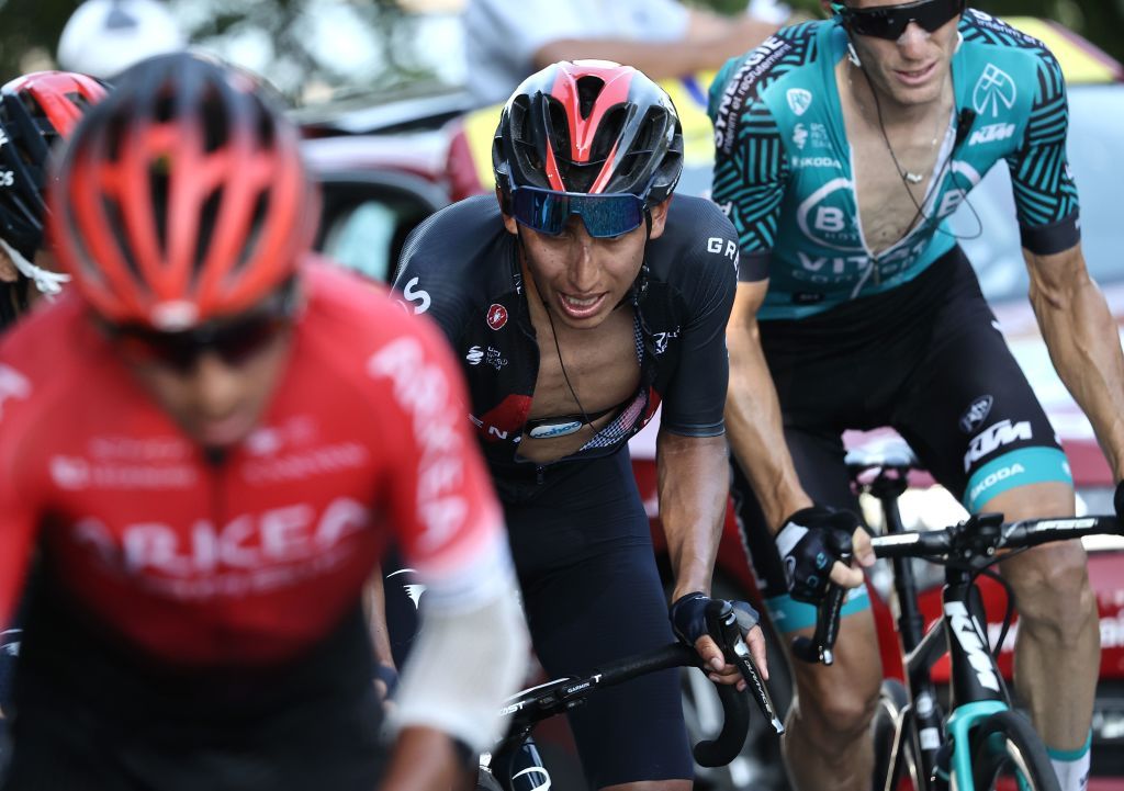 Team Ineos rider Colombias Egan Bernal C climbs the Grand Colombier pass behind the leaders group during the 15th stage of the 107th edition of the Tour de France cycling race 175 km between Lyon and Grand Colombier on September 13 2020 Photo by KENZO TRIBOUILLARD AFP Photo by KENZO TRIBOUILLARDAFP via Getty Images