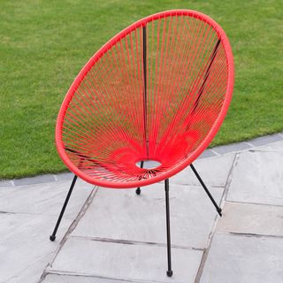 red moon chair in garden