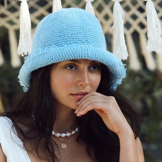 woman wearing blue hat