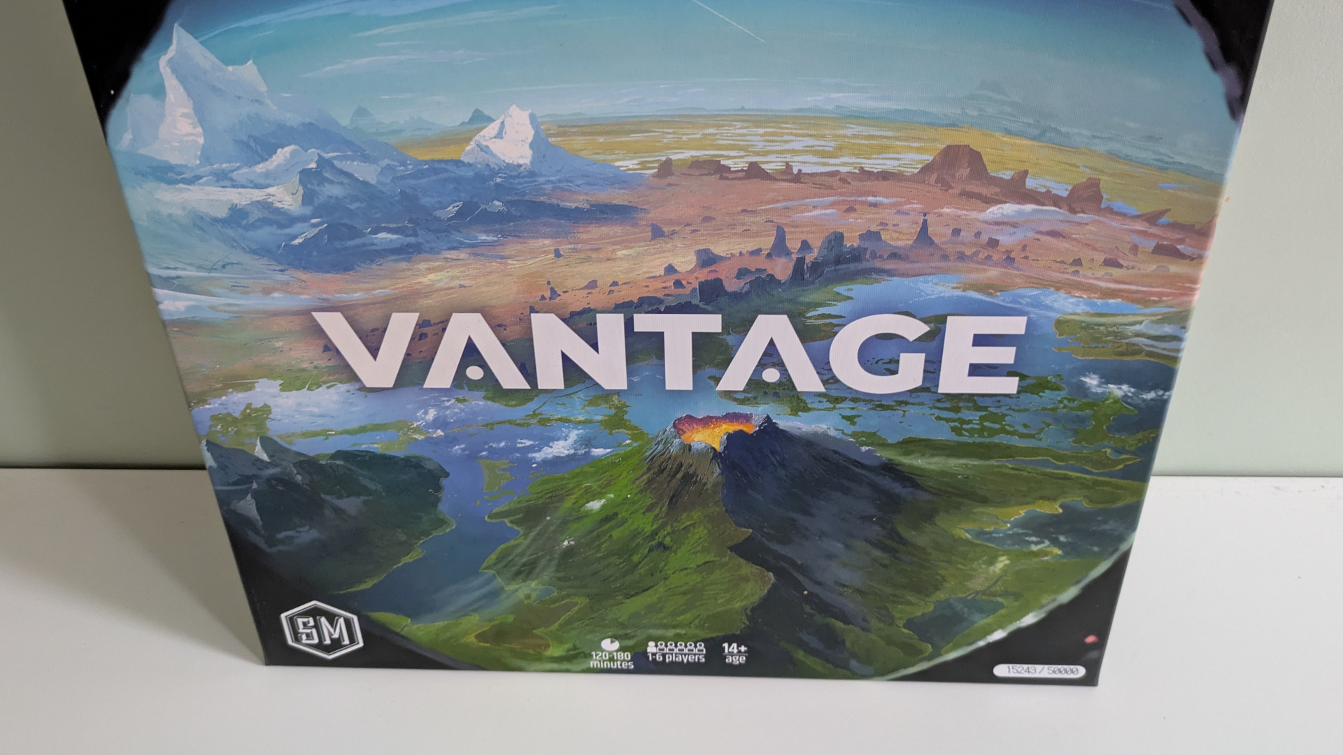 The Vantage box on a white wooden surface, against a plain wall