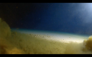 The submersible reaches the bottom of the Challenger Deep in the Mariana Trench.