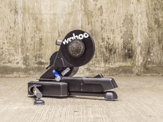 A Wahoo Kickr Move Smart turbo trainer stands in an underground car park