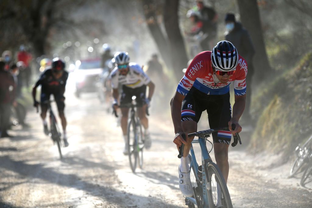 SIENA ITALY MARCH 06 Mathieu Van Der Poel of Netherlands and Team AlpecinFenix Julian Alaphilippe of France and Team Deceuninck QuickStep Egan Arley Bernal Gomez of Colombia and Team INEOS Grenadiers during the Eroica 15th Strade Bianche 2021 Mens Elite a 184km race from Siena to Siena Piazza del Campo Dust Gravel Strokes Attack StradeBianche on March 06 2021 in Siena Italy Photo by Tim de WaeleGetty Images