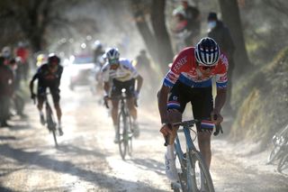 SIENA ITALY MARCH 06 Mathieu Van Der Poel of Netherlands and Team AlpecinFenix Julian Alaphilippe of France and Team Deceuninck QuickStep Egan Arley Bernal Gomez of Colombia and Team INEOS Grenadiers during the Eroica 15th Strade Bianche 2021 Mens Elite a 184km race from Siena to Siena Piazza del Campo Dust Gravel Strokes Attack StradeBianche on March 06 2021 in Siena Italy Photo by Tim de WaeleGetty Images