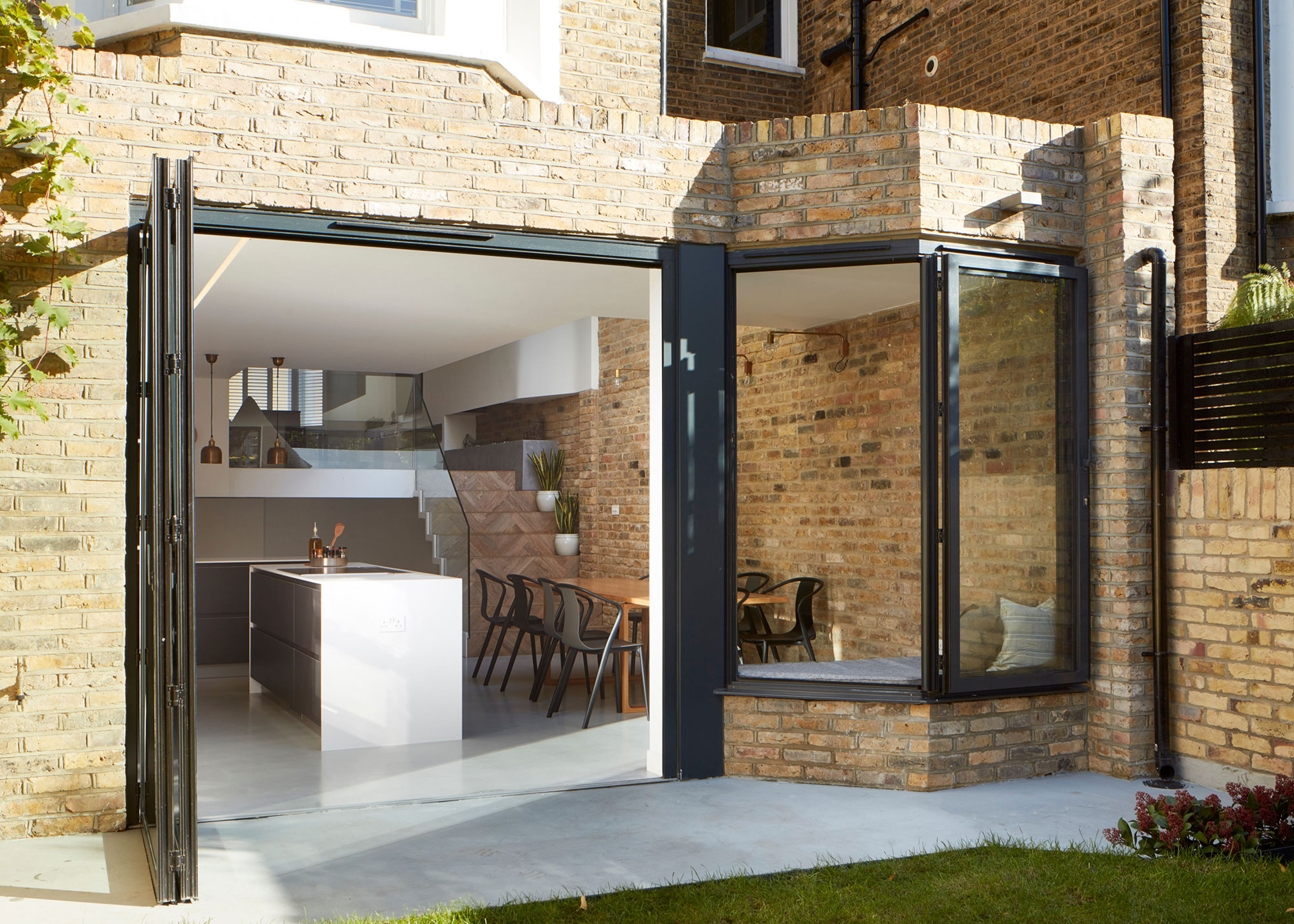brick kitchen extension with black aluminium bifold doors