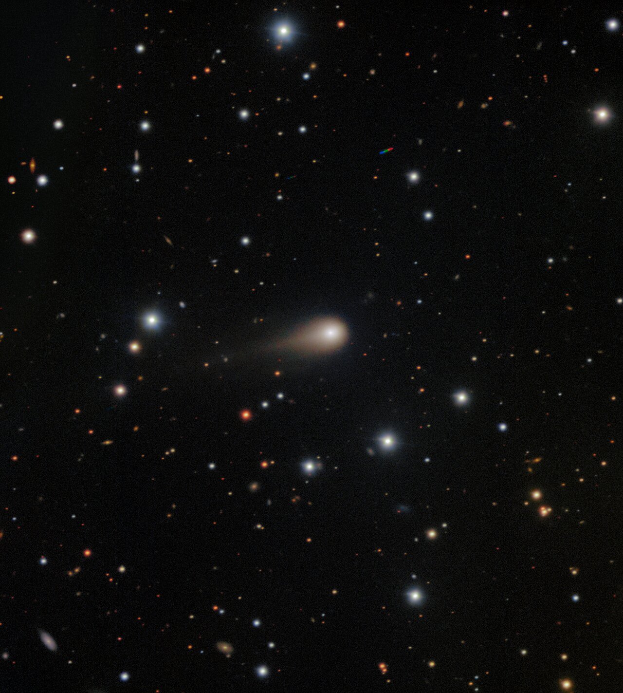 The image shows the comet&amp;rsquo;s broad coma &amp;mdash; a cloud of gas and dust that forms around the comet&amp;rsquo;s icy nucleus as it gets closer to the Sun &amp;mdash; and a tail spanning about 1/120th of a degree in the sky (where one degree is about the width of a pinky finger on an outstretched arm) and pointing away from the Sun. 3I/ATLAS is only the third confirmed interstellar visitor to our Solar System. The exposures tracked the comet as it traveled across the sky, and the final image is composed to freeze the stars in place during the observation. Two small colored trails from unrelated asteroids with a different motion from that of the comet can also be seen.