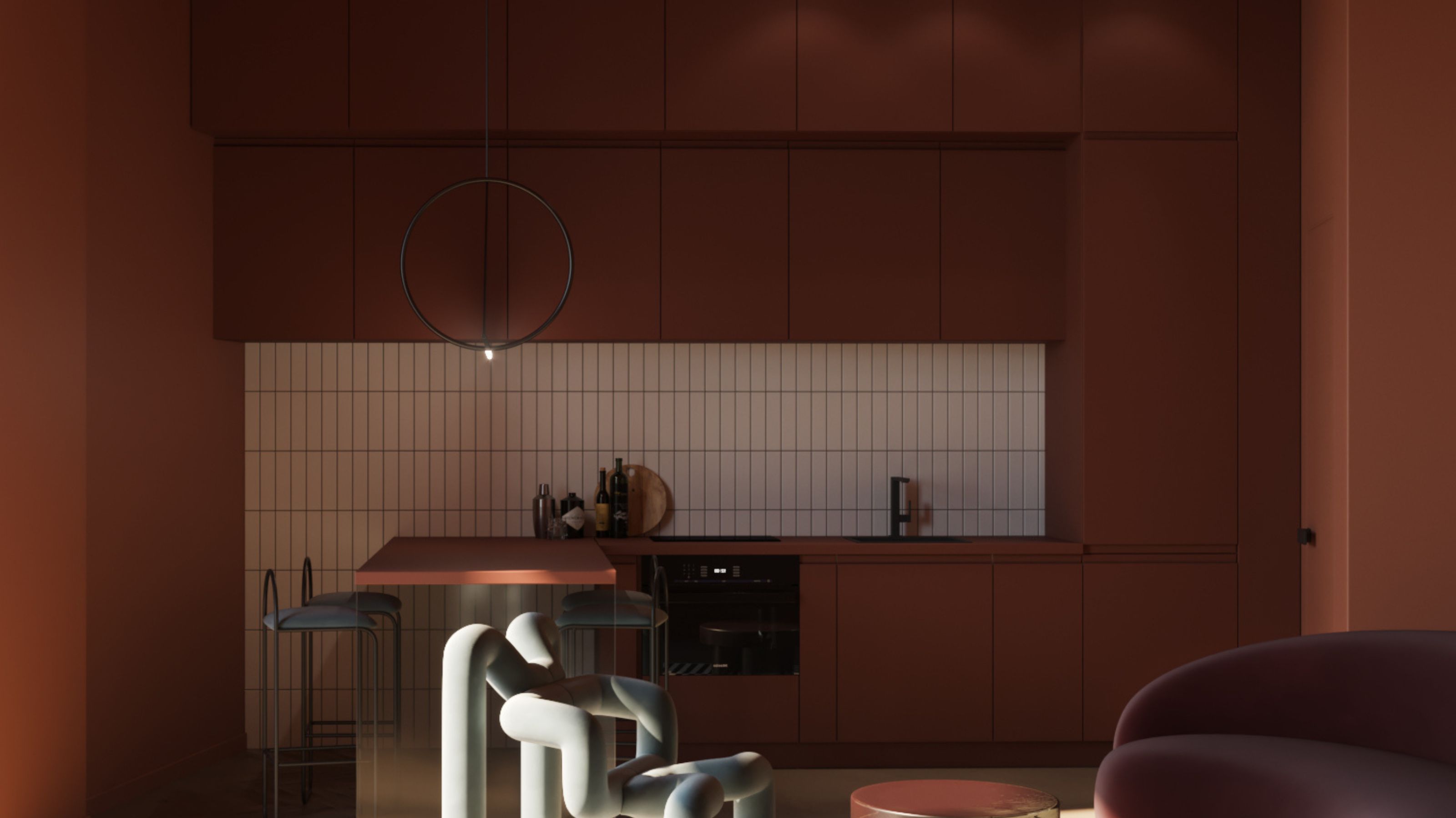 A kitchen painted red, with an island extension in the same hues 