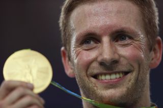 Jason Kenny smiles for the camera after winning the gold in the keirin