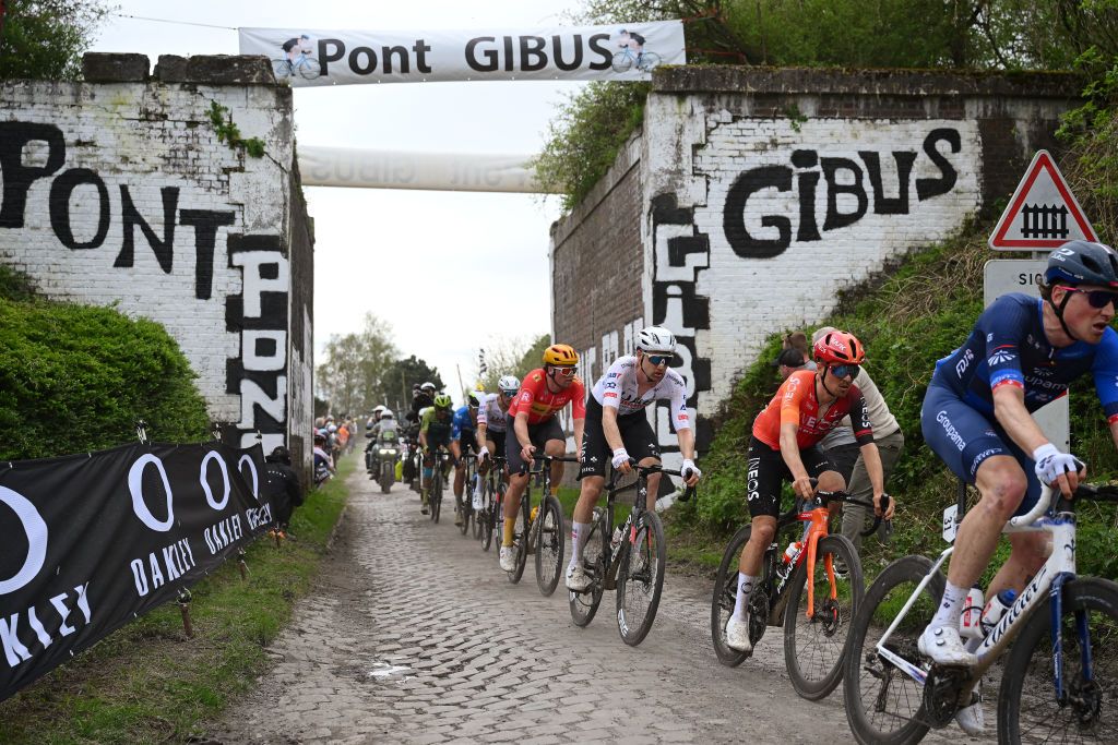 ROUBAIX FRANCE APRIL 07 LR Tim Wellens of Belgium and UAE Team Emirates and Thomas Pidcock of The United Kingdom and Team INEOS Grenadiers compete passing through the Gibus bridge during the 121st ParisRoubaix 2024 a 2597km one day race from Compiegne to Roubaix UCIWT on April 07 2024 in Roubaix France Photo by Dario BelingheriGetty Images