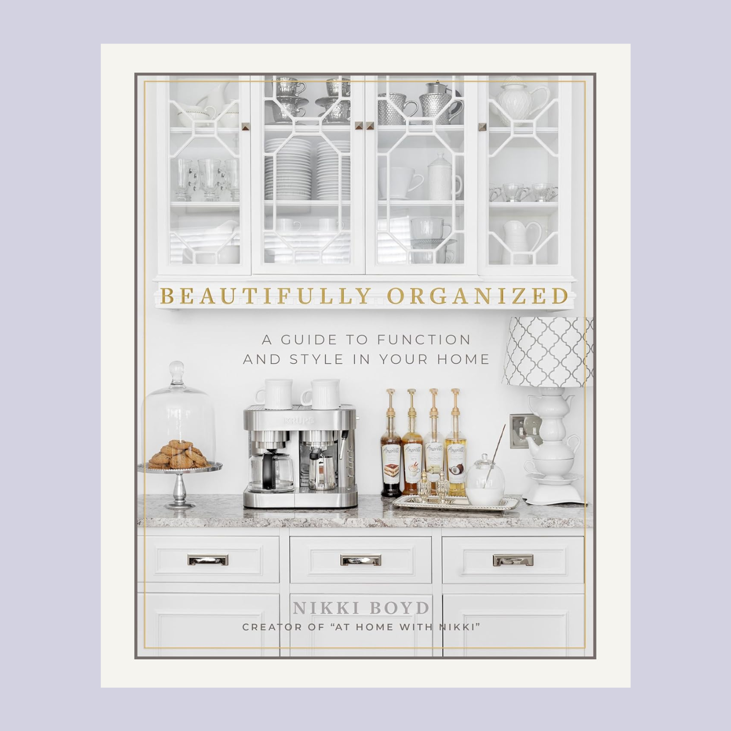 A white hardcover book with an organized kitchen on the front cover titled 'Beautifully Organized' by Nikki Boyd