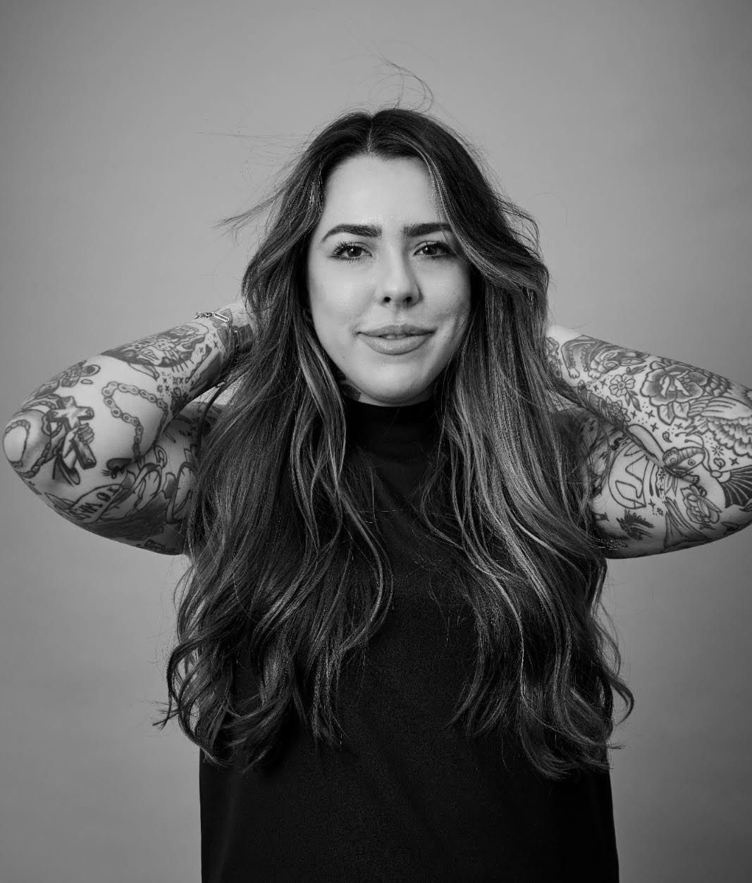 black and white headshot of hairstylist and colorist Emily Claire