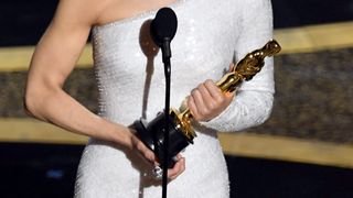 Woman holding an Oscar trophy