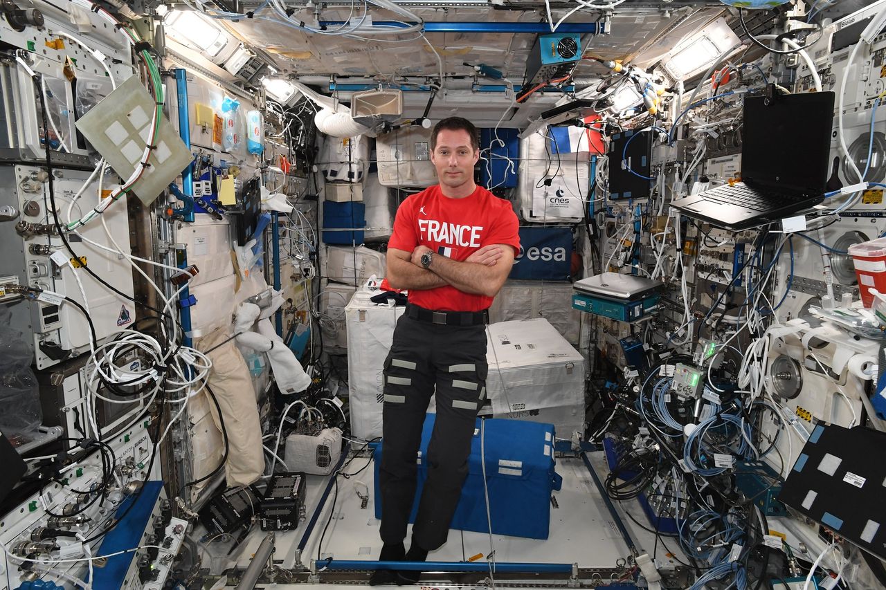 French astronaut Thomas Pesquet of the European Space Agency celebrated France's Bastille Day holiday in space with festive shirts and a meal with friends on July 14, 2021 aboard the International Space Station.