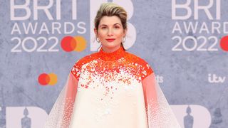 Time series 2 star Jodie Whittaker in a pink and white dress attending the 2022 BRIT Awards