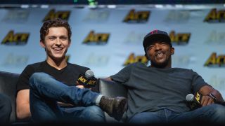 Anthony Mackie and Tom Holland laughing at ACE Comic Con in 2018 
