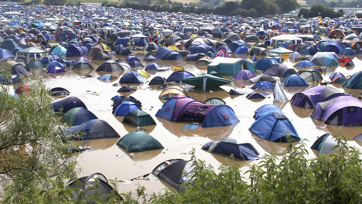 Tents in a waterlogged field