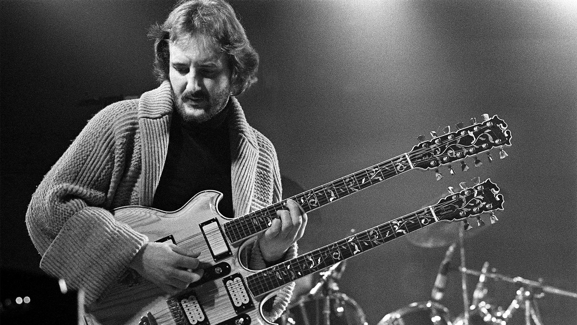 Dutch guitarist Jan Akkerman performs on stage, Dreampop, Roosendaal, Netherlands, 30th April 1979. He plays a twin-neck guitar.