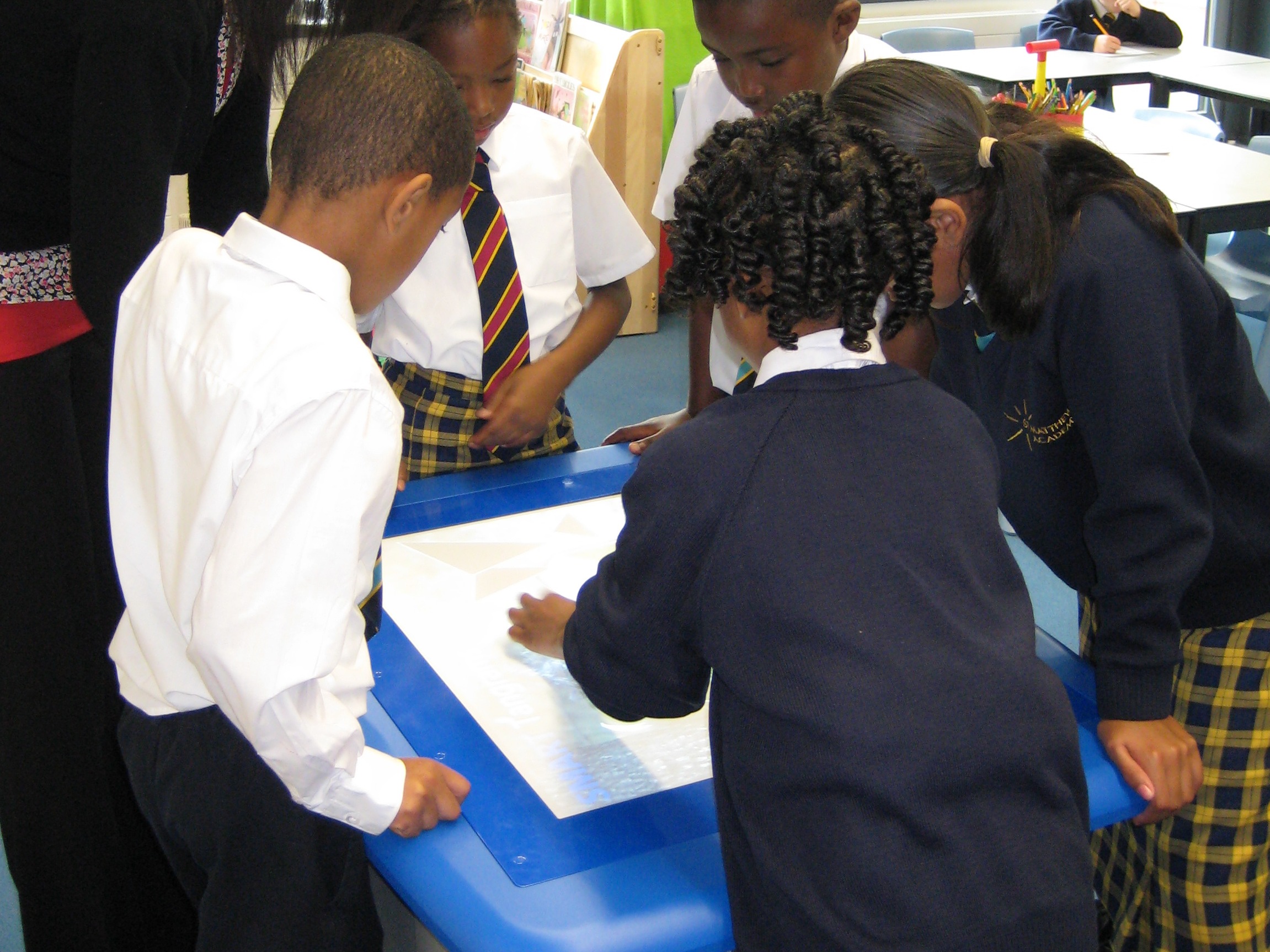 children at St.Matthew Academy, Lewisham, London using the Table