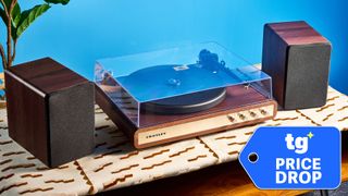 Crosley C65 photographed on a brown table in front of a blue background with a price drop tag overlay