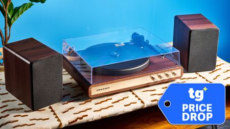 Crosley C65 photographed on a brown table in front of a blue background with a price drop tag overlay
