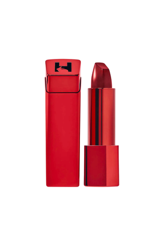 Emily Ratajkowski Hourglass red lipstick on a plain backdrop
