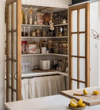 A pantry with cafe curtains