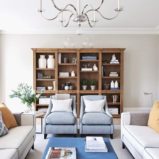 living room with sofa set and cupboard