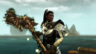 Guild Wars 2 - A player holds a legendary hammer with the Zhaitan skin.