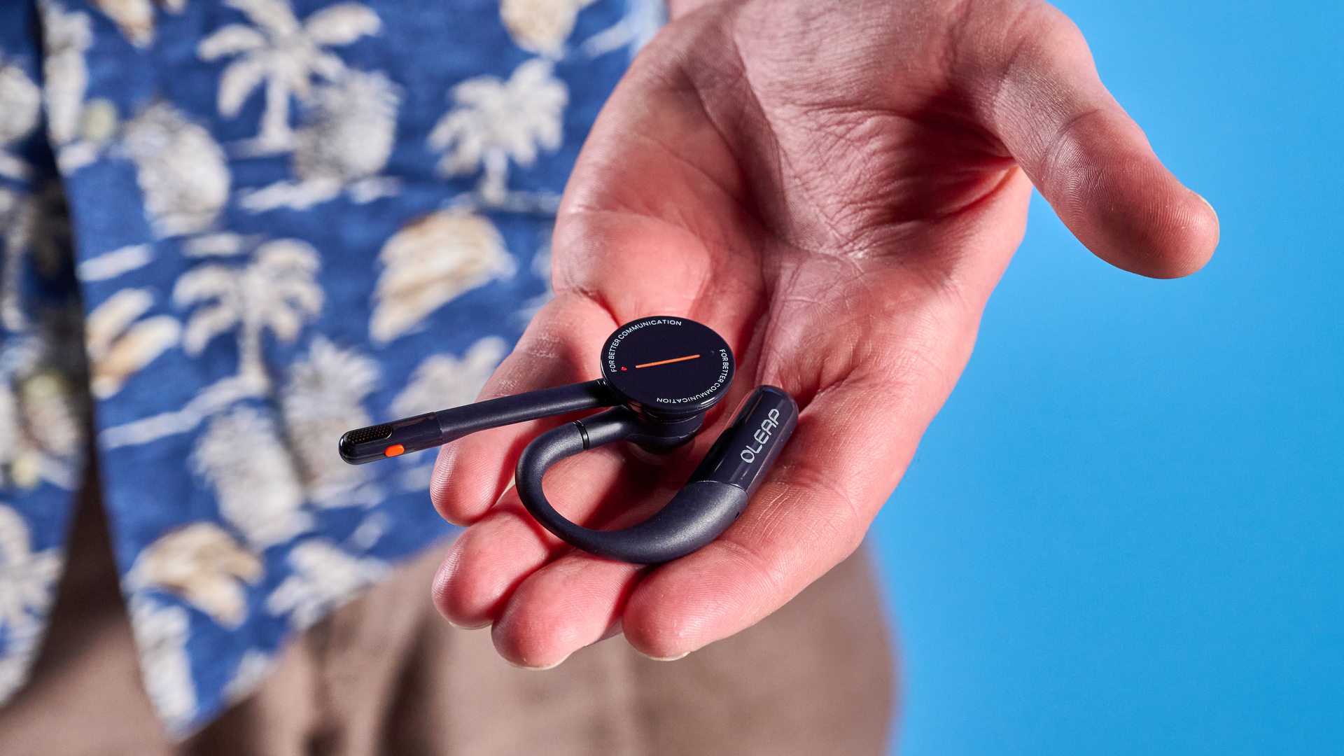 Oleap Archer AI Meeting Headset photographed in front of a blue background.