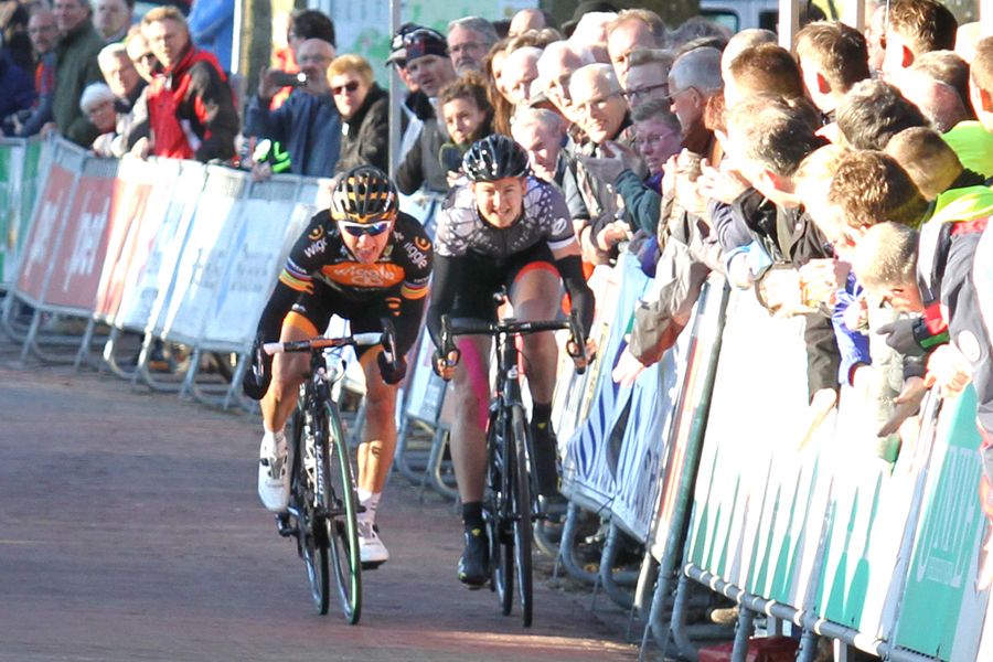 The spectator starts to put in hand in front of Loren Rowney (Velocio-SRAM)