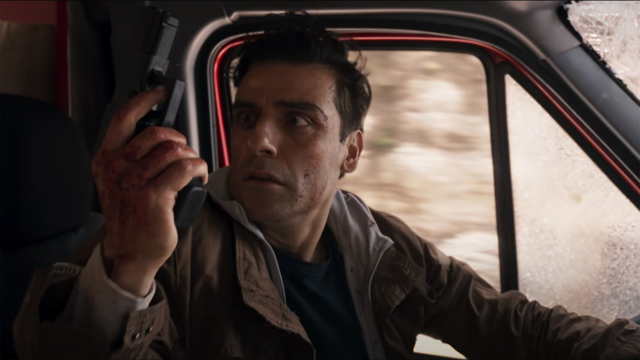 Steven Grant looks shocked as he holds a pistol in Marvel Studios' Moon Knight TV show