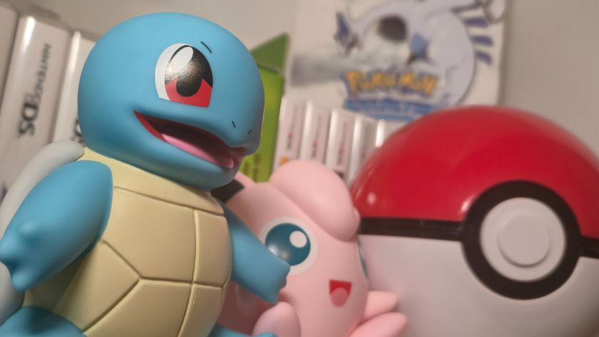 Squirtle and Jigglypuff figures alongside a Poke Ball, with Nintendo DS game cases visible in the background