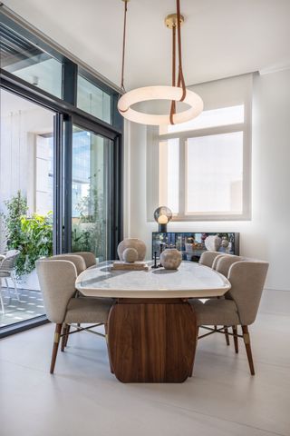 an apartment dining room with a bespoke table