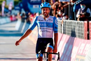 Team Israel StartUp Nation rider Englands Alex Dowsett celebrates as he crosses the line for victory during the 8th stage of the Giro dItalia 2020 cycling race a 200kilometer route between Giovinazzo and Vieste on October 10 2020 Photo by Luca Bettini AFP Photo by LUCA BETTINIAFP via Getty Images