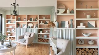 pastel coloured built-in bookshelves with tube detailing on the doors