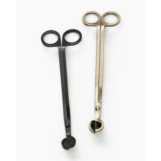 Two pairs of candle wick trimmers, one black, one brass