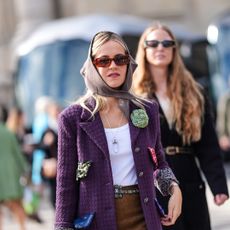 parisian street style woman wearing blazer and head scarf