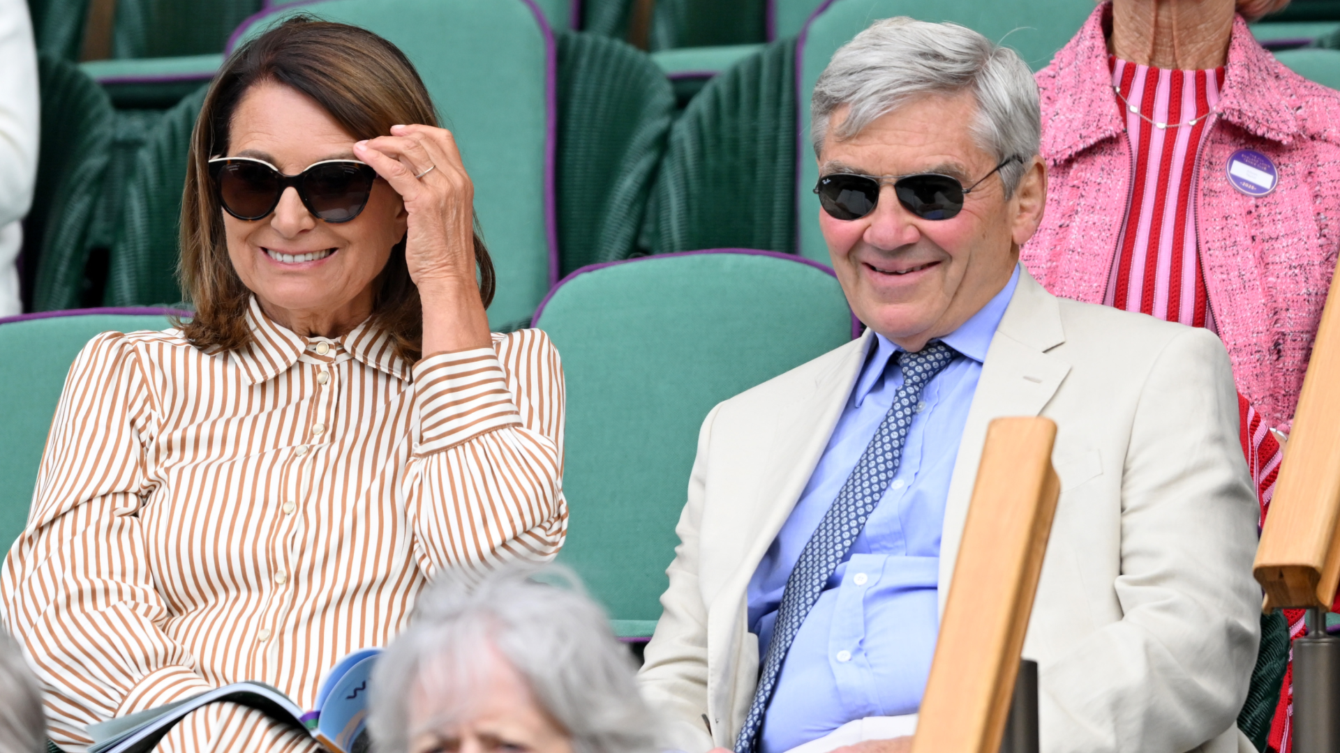Carole and Michael Middleton smiling in the royal box at Wimbledon