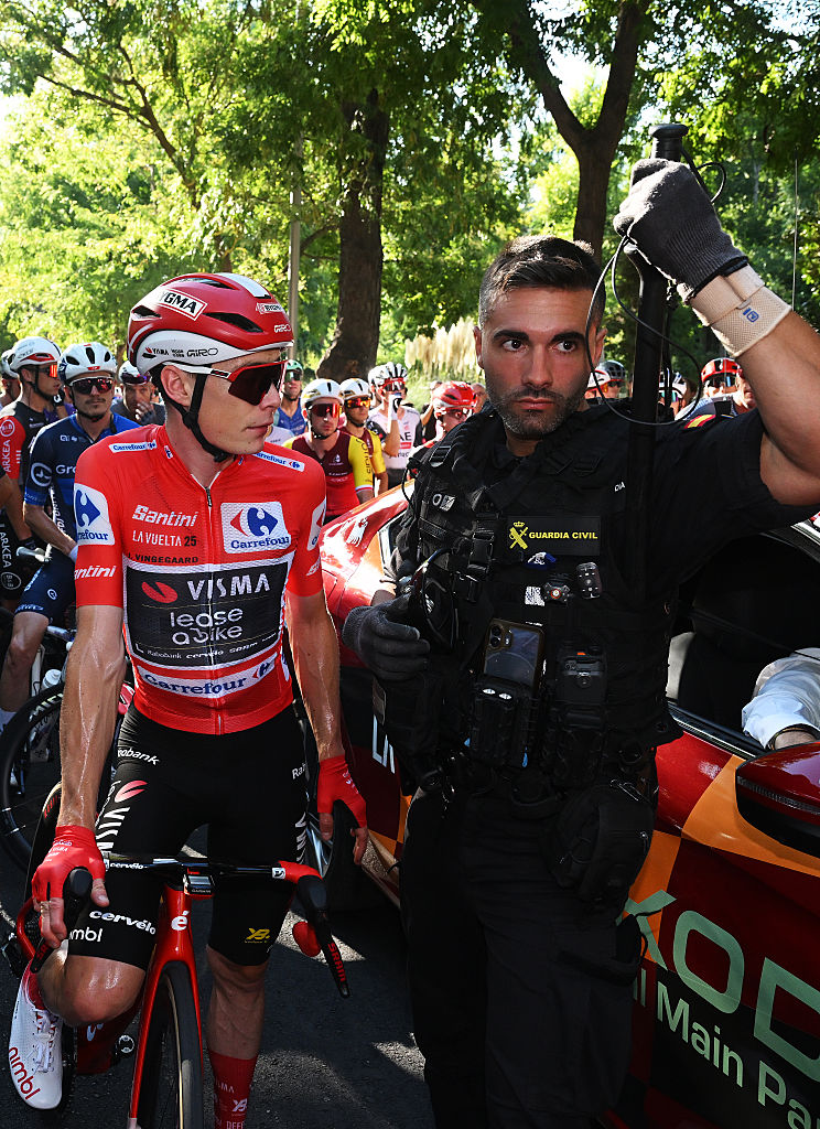 MADRID, SPAIN - SEPTEMBER 14: Jonas Vingegaard of Denmark and Team Visma | Lease a Bike - Red Leader Jersey and the peloton is at a standstill due to the pro-Palestinian protests in the city of Madrid during the La Vuelta - 80th Tour of Spain 2025, Stage 21 a 108km stage from Alalpardo to Madrid / The race is neutralised due to disturbances in central Madrid caused by pro-Palestinian protests / #UCIWT / on September 14, 2025 in Madrid, Spain. (Photo by Dario Belingheri/Getty Images)