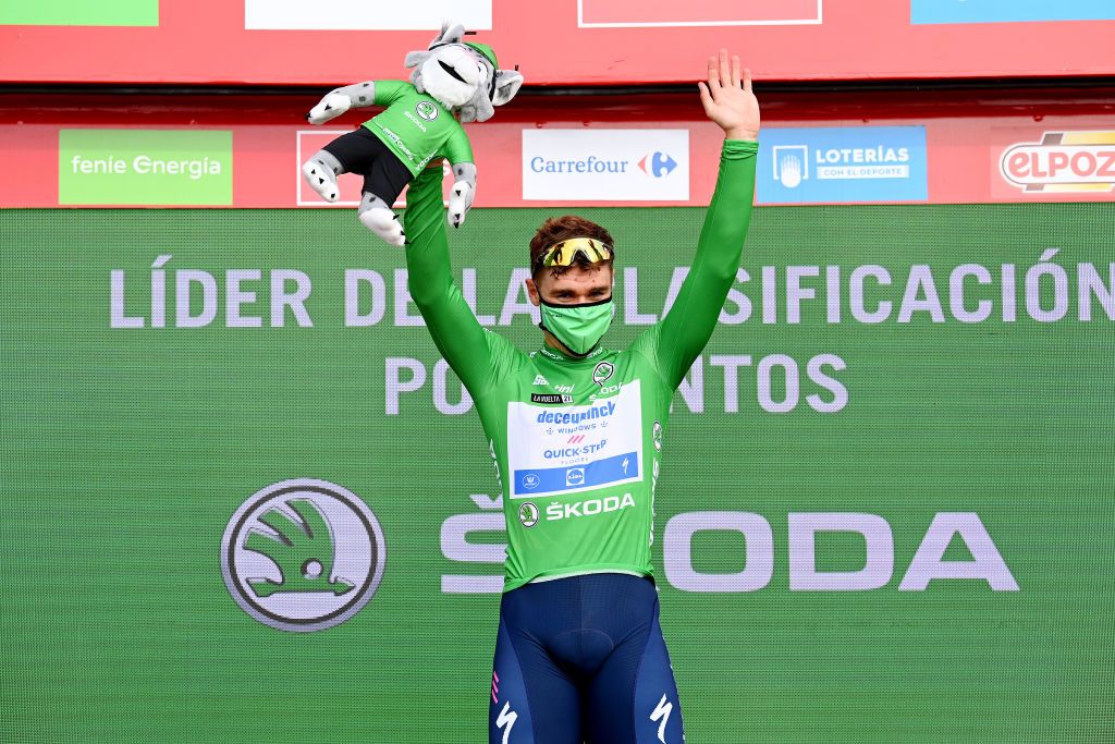 LA MANGA SPAIN AUGUST 21 Fabio Jakobsen of Netherlands and Team Deceuninck QuickStep celebrates winning the green points jersey on the podium ceremony after the 76th Tour of Spain 2021 Stage 8 a 1737 km stage from Santa Pola to La Manga del Mar Menor lavuelta LaVuelta21 on August 21 2021 in La Manga Spain Photo by Stuart FranklinGetty Images