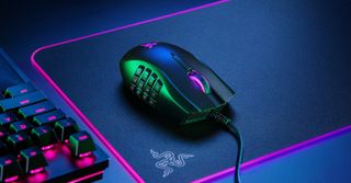 Razer Naga on an RGB mousepad in sumptuous "bisexual" blue and pinkish red lighting