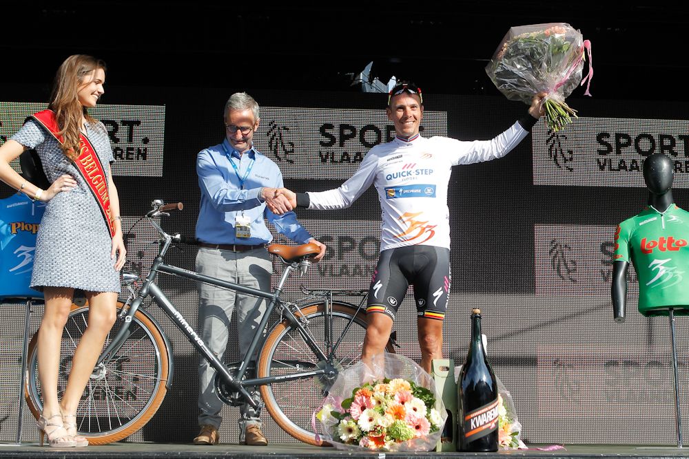Philippe Gilbert on the podium after winning stage 1 at Three Days of De Panne
