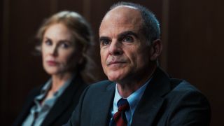 Nicole Kidman as Kaitlyn Meade sitting to the left and in the background of Michael Kelly as Byron Westfield.