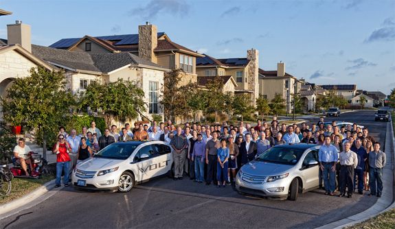 Photo of Mueller residents and researchers with Chevrolet Volt cars