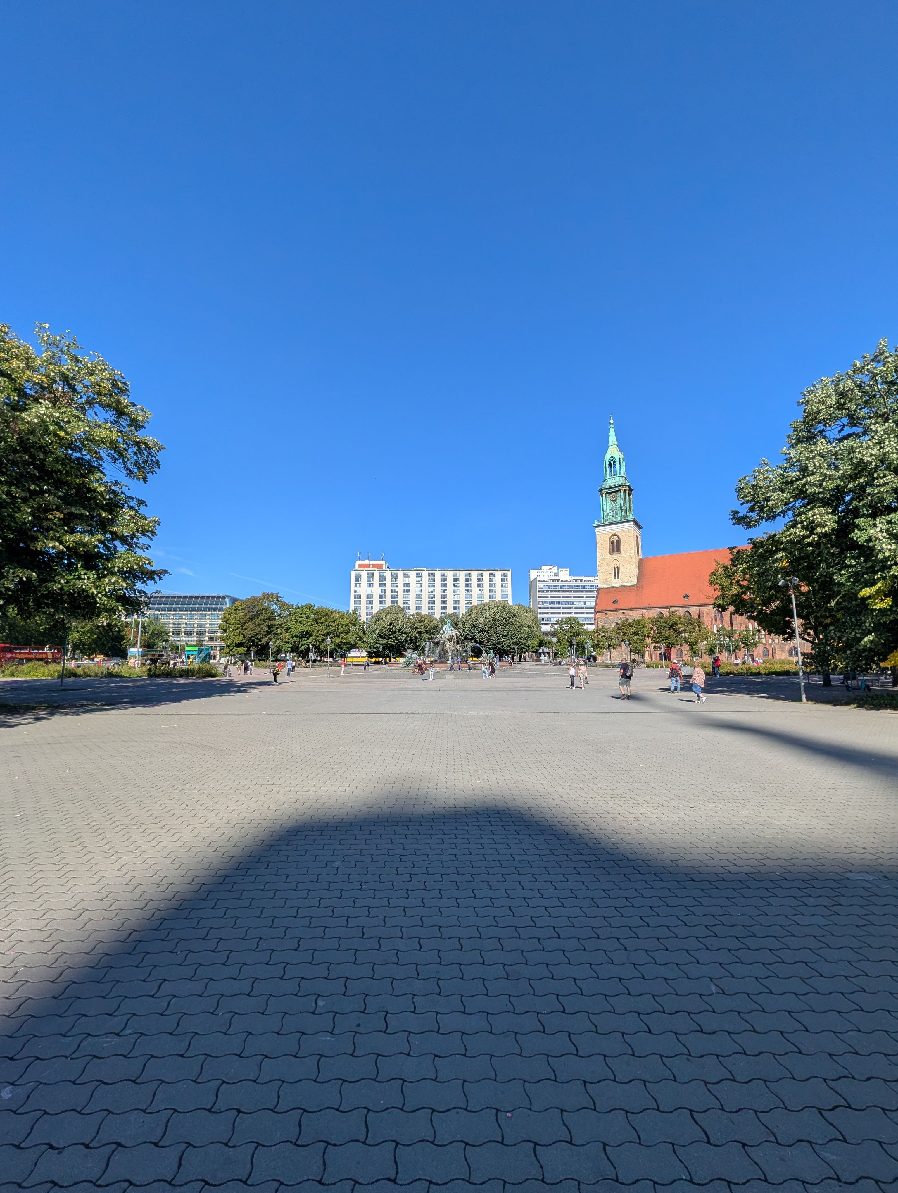 A town Square in Berlin with a blue sky