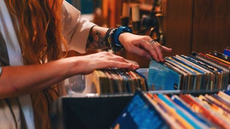 Woman browsing through vinyl records