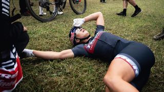 A pro rider on a floor after a race