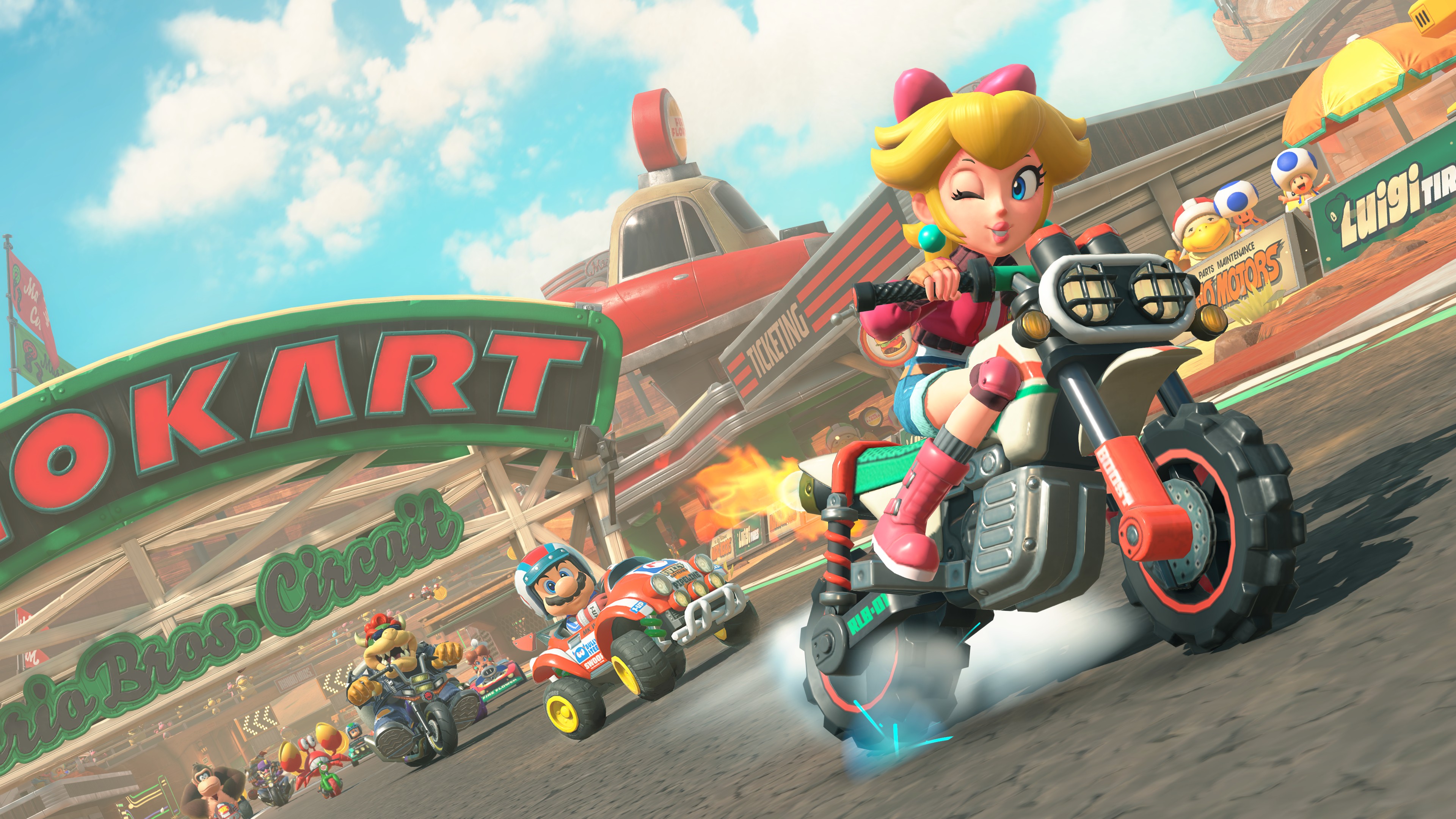 Mario Kart World screenshot featuring Peach on a motorcycle leading the pack